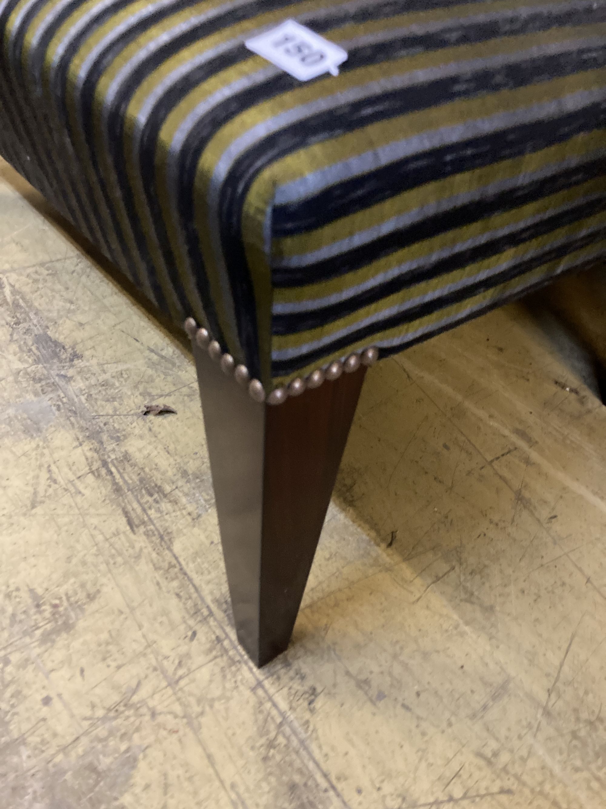 A modern rectangular footstool on square tapered legs, width 100cm, depth 56cm, height 38cm